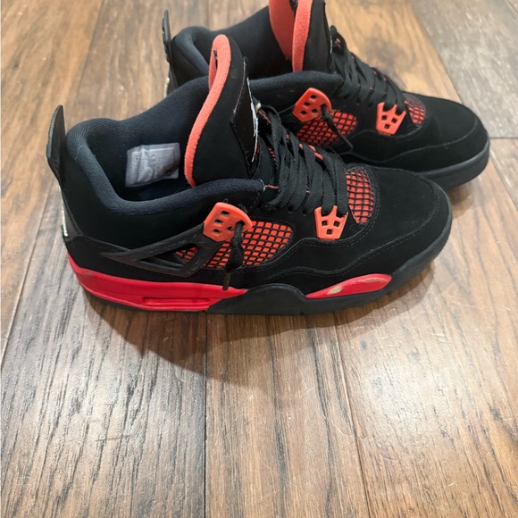 Nike Jordan 4 Thunders Black and Red High-Top Sneakers